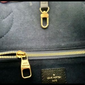 Mint condition authentic Louis Vuitton tote bag in black.